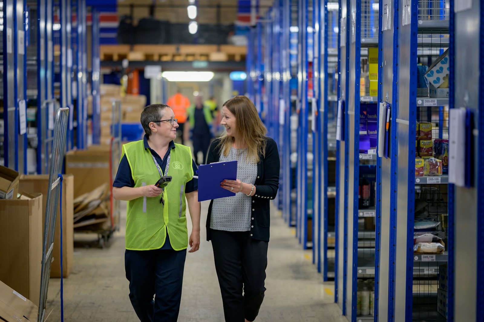 Warehouse staff scanning cargo documentation